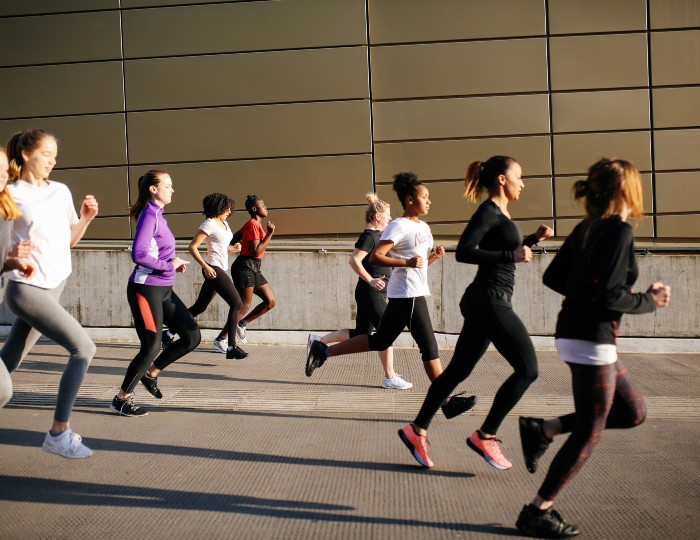 Women running in a city