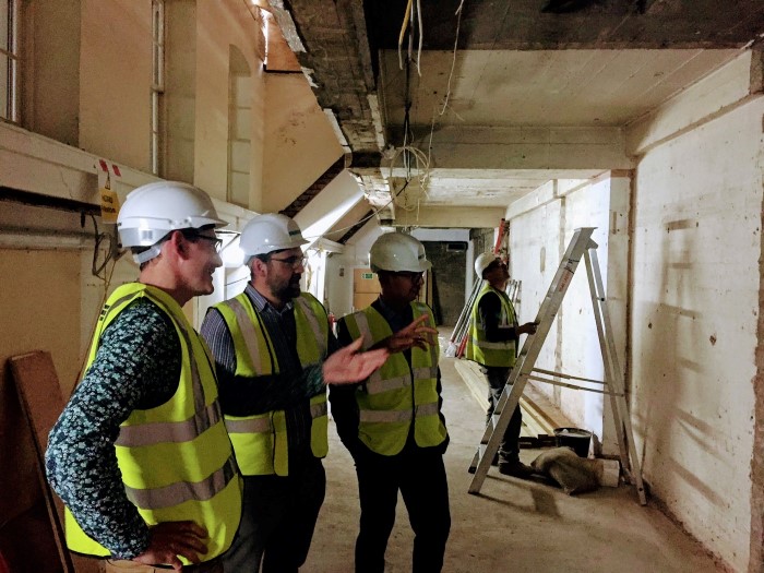 Andrew Parkes, Cognitive Media (centre), with Oliver Reichardt, RSA Director of Fellowship (left), looking at the space in the coffeehouse where the RSAnimate mural will be hung.