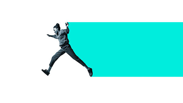 A person in a dynamic pose, seemingly leaping or running, is silhouetted against a turquoise rectangle on a white background. They are dressed in casual clothing with arms and legs outstretched, creating a sense of movement.