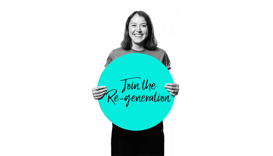 Smiling person holding a large turquoise circle with the text "Join the Re-generation" written on it. The background is white and the image is in black and white, except for the turquoise circle.