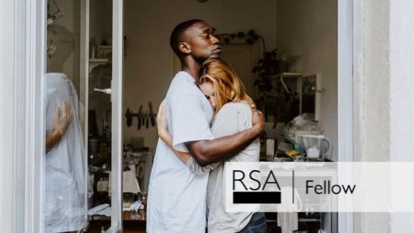 A man and woman embrace in a doorway, both looking serious. The interior shows a cluttered room. The image includes an overlay with the text "RSA Fellow.