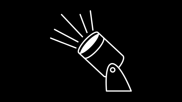 A simple line drawing of a spotlight tilted upwards, shining light rays. The image is set against a black background.