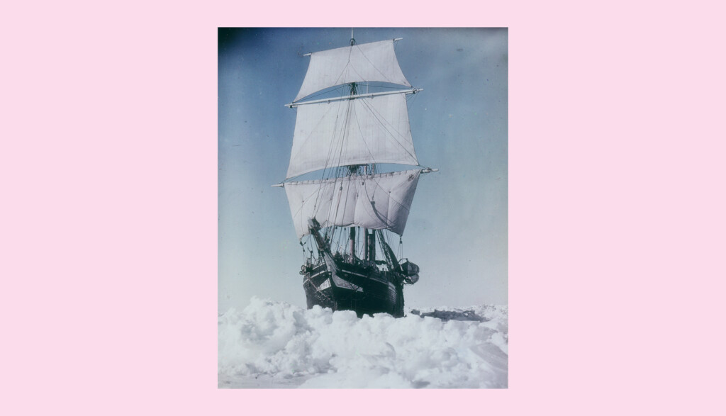 A ship with tall sails navigates through frozen, icy waters against a soft pink sky. The vessel appears trapped in large blocks of ice, conveying a sense of isolation and adventure in a cold, desolate setting.