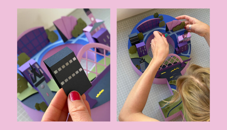 Two photos show a person assembling a colorful 3D paper model of a cityscape with buildings, trees, and a bridge. One close-up shows a hand holding a black building; the other shows arranging the model from above.