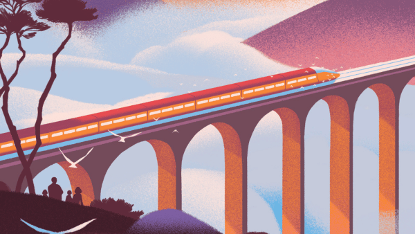A modern red train crosses a tall arched viaduct at sunset, with birds flying nearby and two silhouetted figures watching from a grassy hill in the foreground.