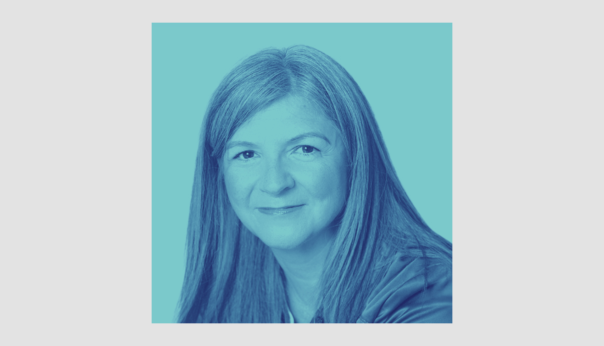 A woman with straight, shoulder-length hair smiles slightly at the camera. The image uses a blue color filter and has a plain blue background.