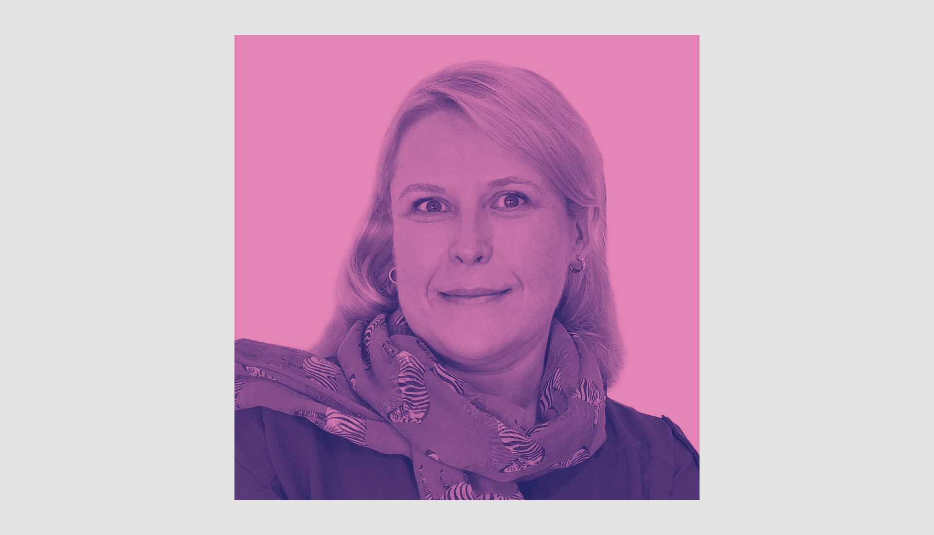 A woman with light hair is smiling slightly, wearing a patterned scarf and dark top, set against a pink background. The image has a pink and purple color overlay.