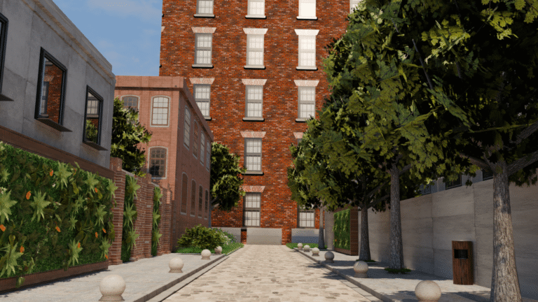 A cobblestone alley lined with trees and green plants leads to a tall brick building with many windows. Other buildings with greenery and large windows flank the alley under a blue sky.