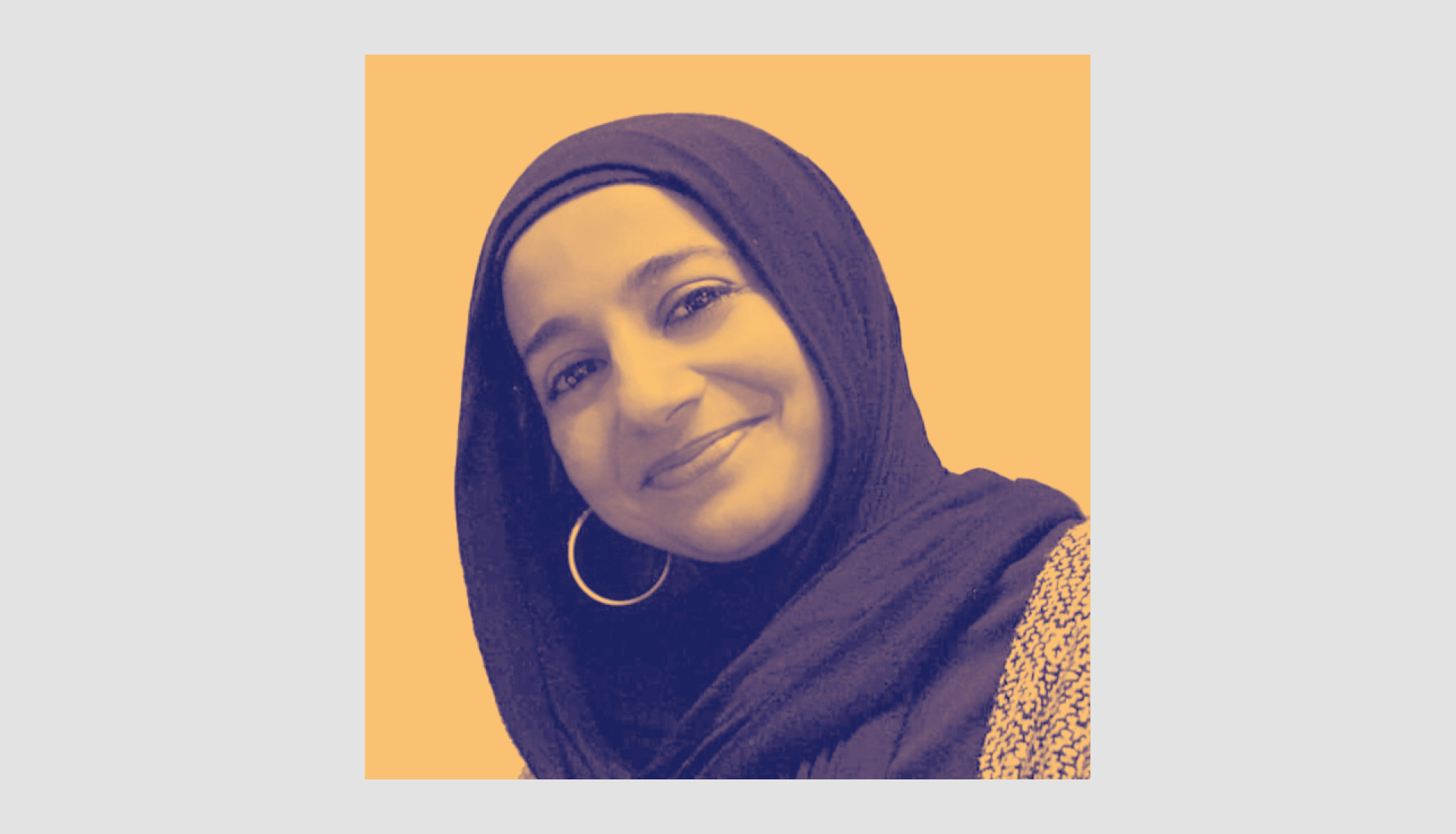 A woman wearing a hijab and hoop earrings smiles at the camera. The photo has a yellow-orange background and a cool-toned color filter.