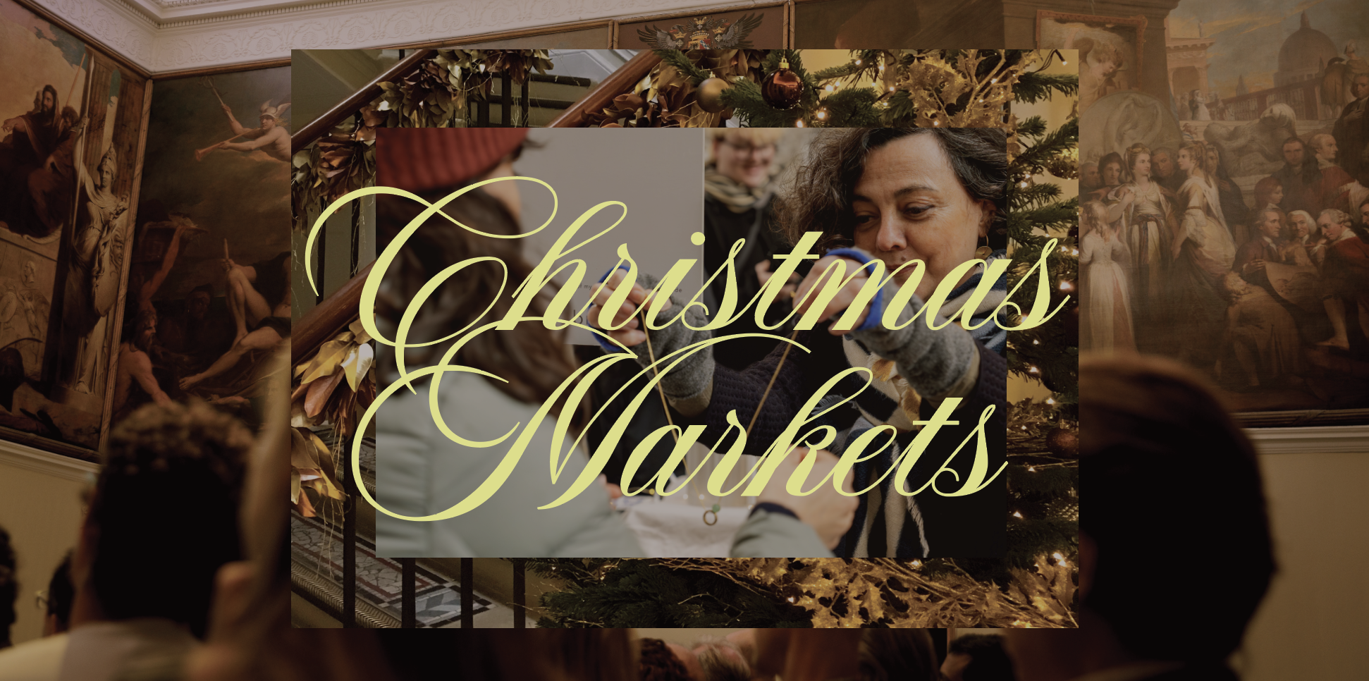 A festive image with elegant gold script reading “Christmas Markets” over a photo of a woman handing something to another person, surrounded by Christmas decorations, and an audience in a decorated hall at Dinings Masaki Sugisaki.